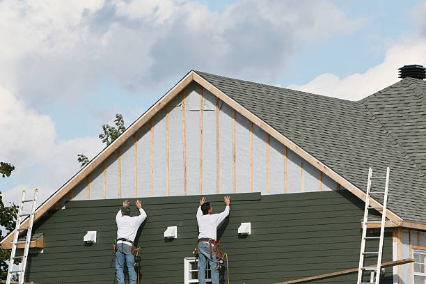 Professional Siding Installation technician working in Woodland, PA